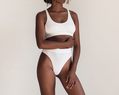 Woman with a white matching underwear set